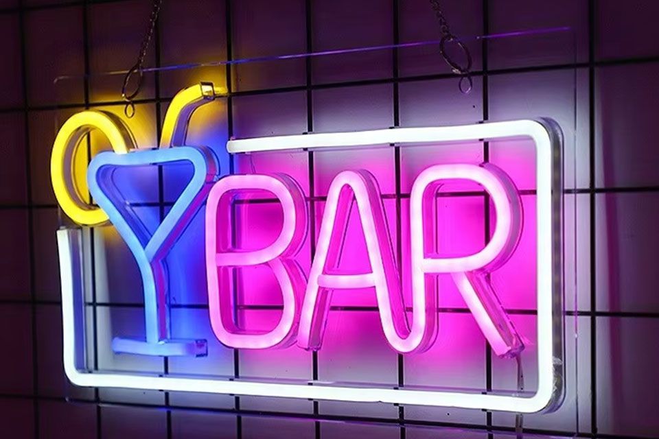 pink and blue neon beer sign 